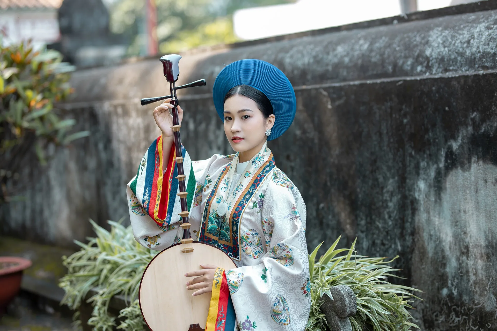 Vietnamese woman with a traditional instrument