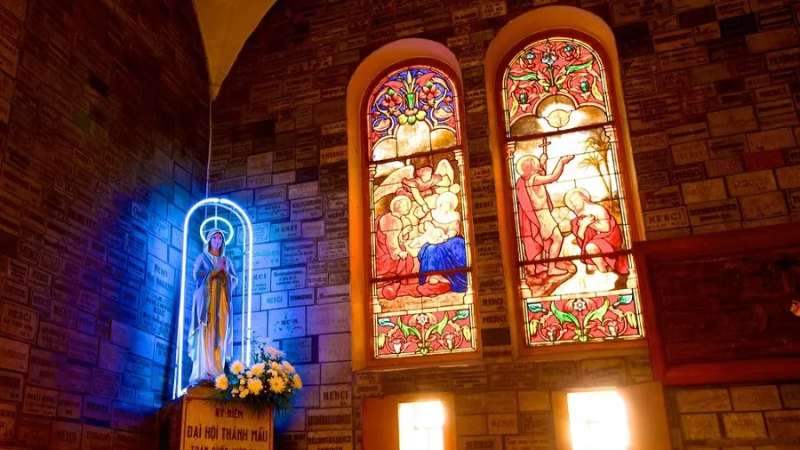 The church's architecture is adorned with colorful windows
