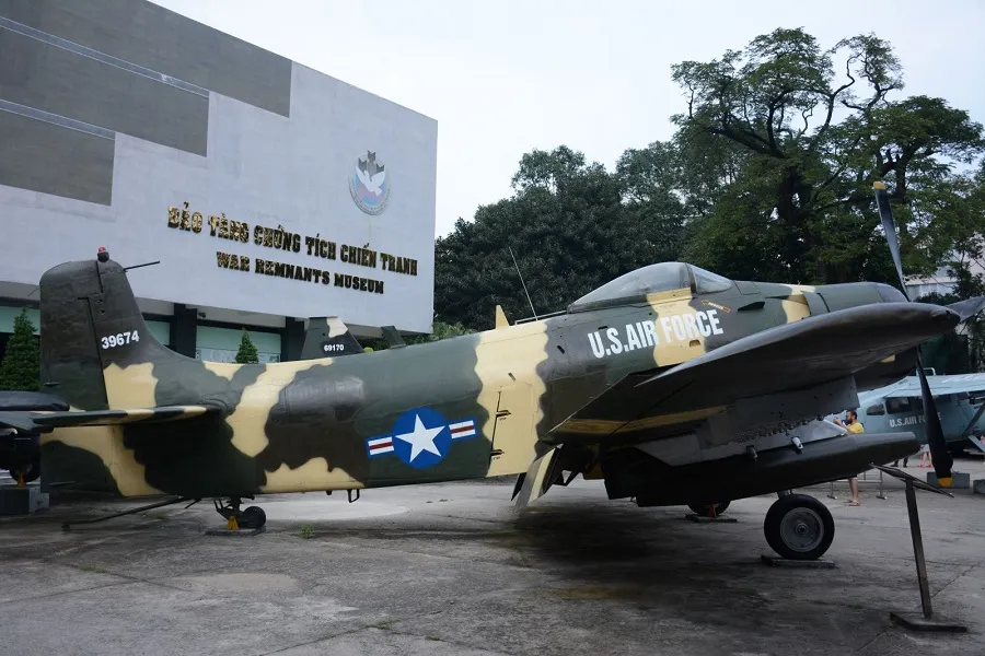 Fighter aircraft are displayed in front of the museum
