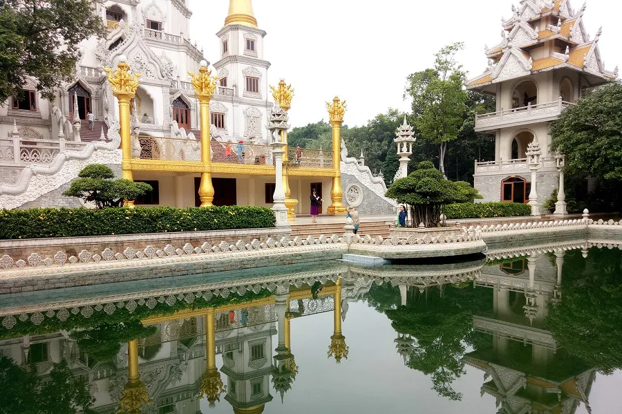 The silhouette of Buu Long Pagoda is hidden under the lake
