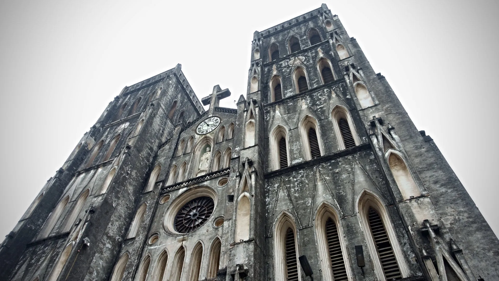 run down exterior of st joseph cathedral in hanoi