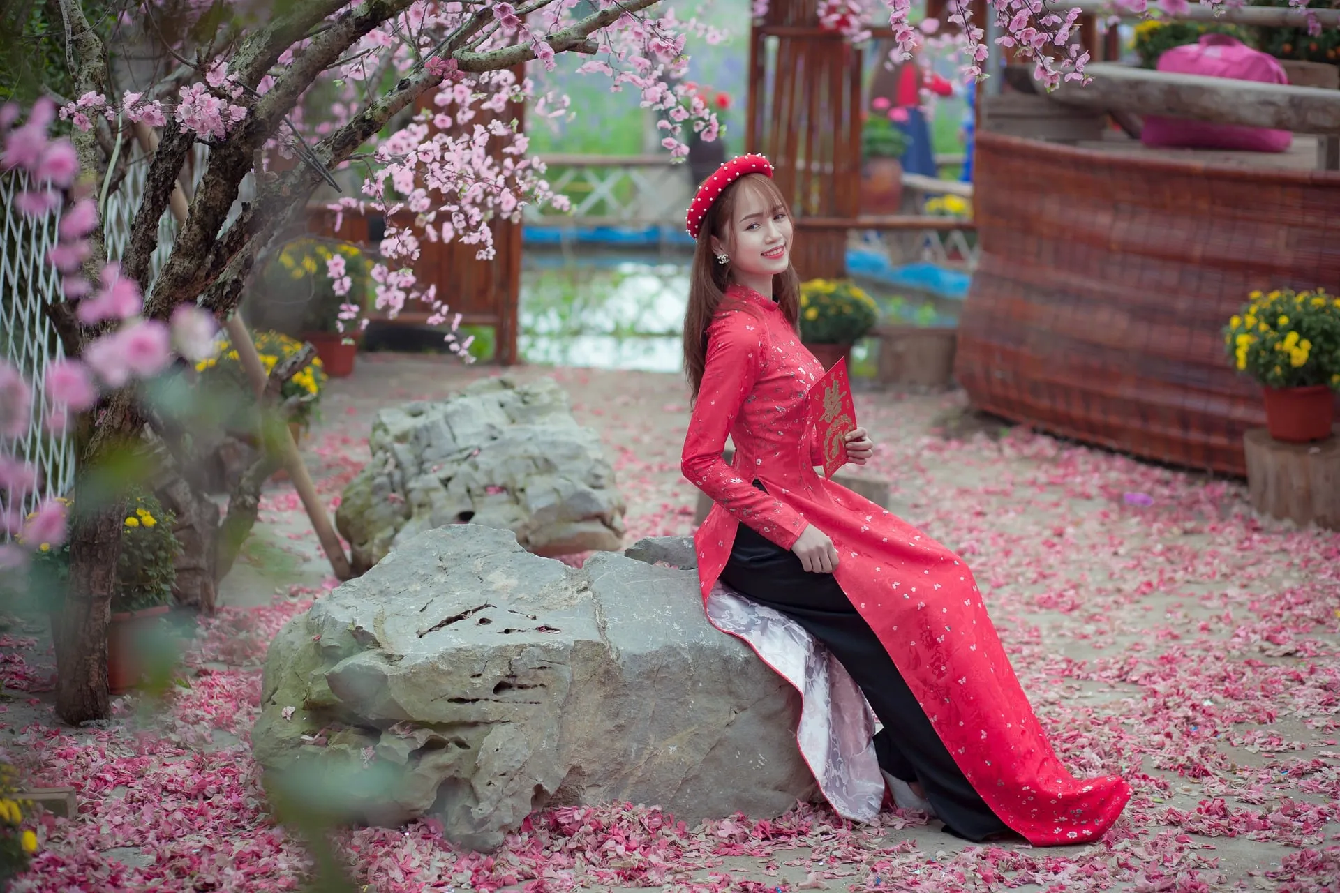 woman wearing red ao dai