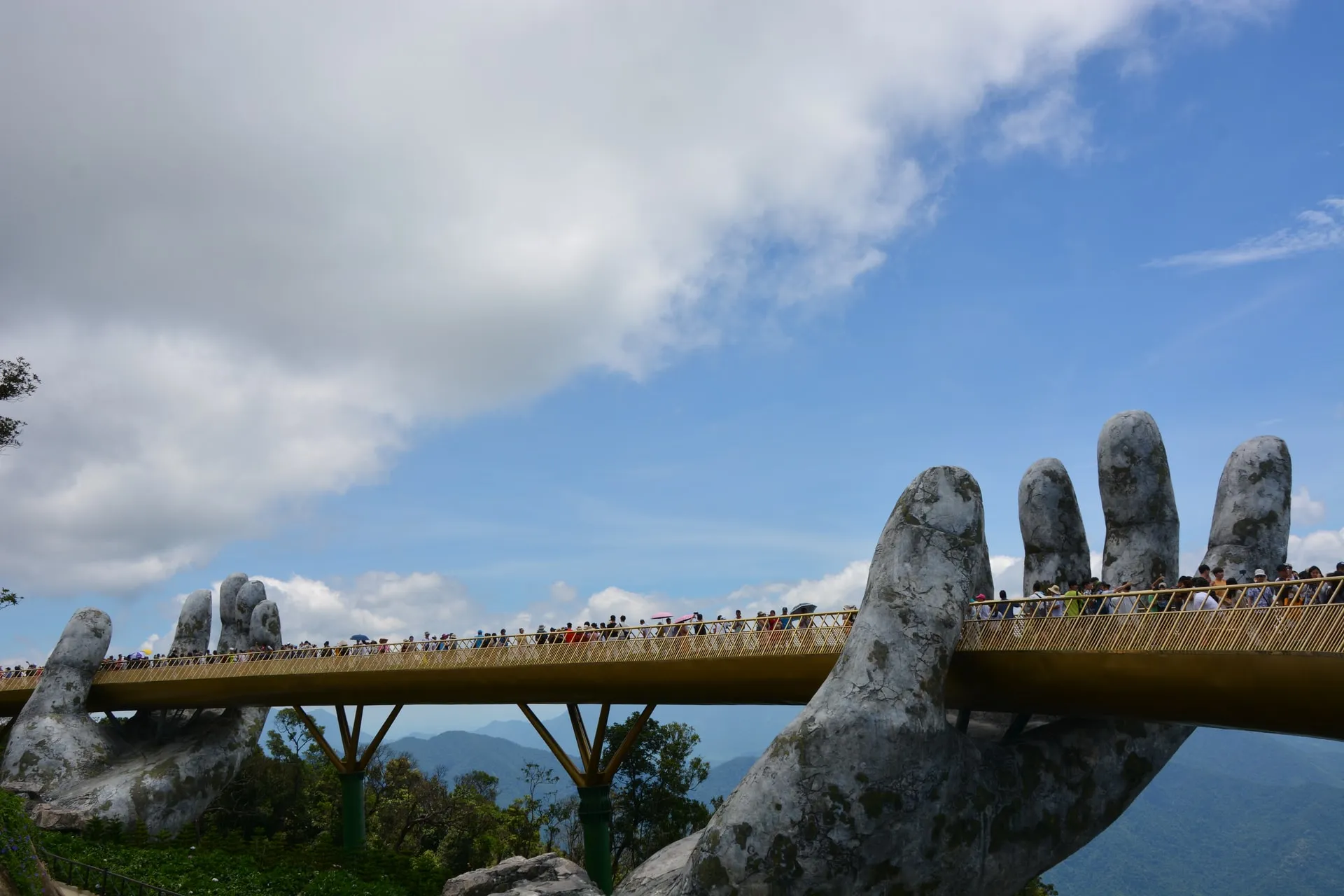 A crowded golden bridge