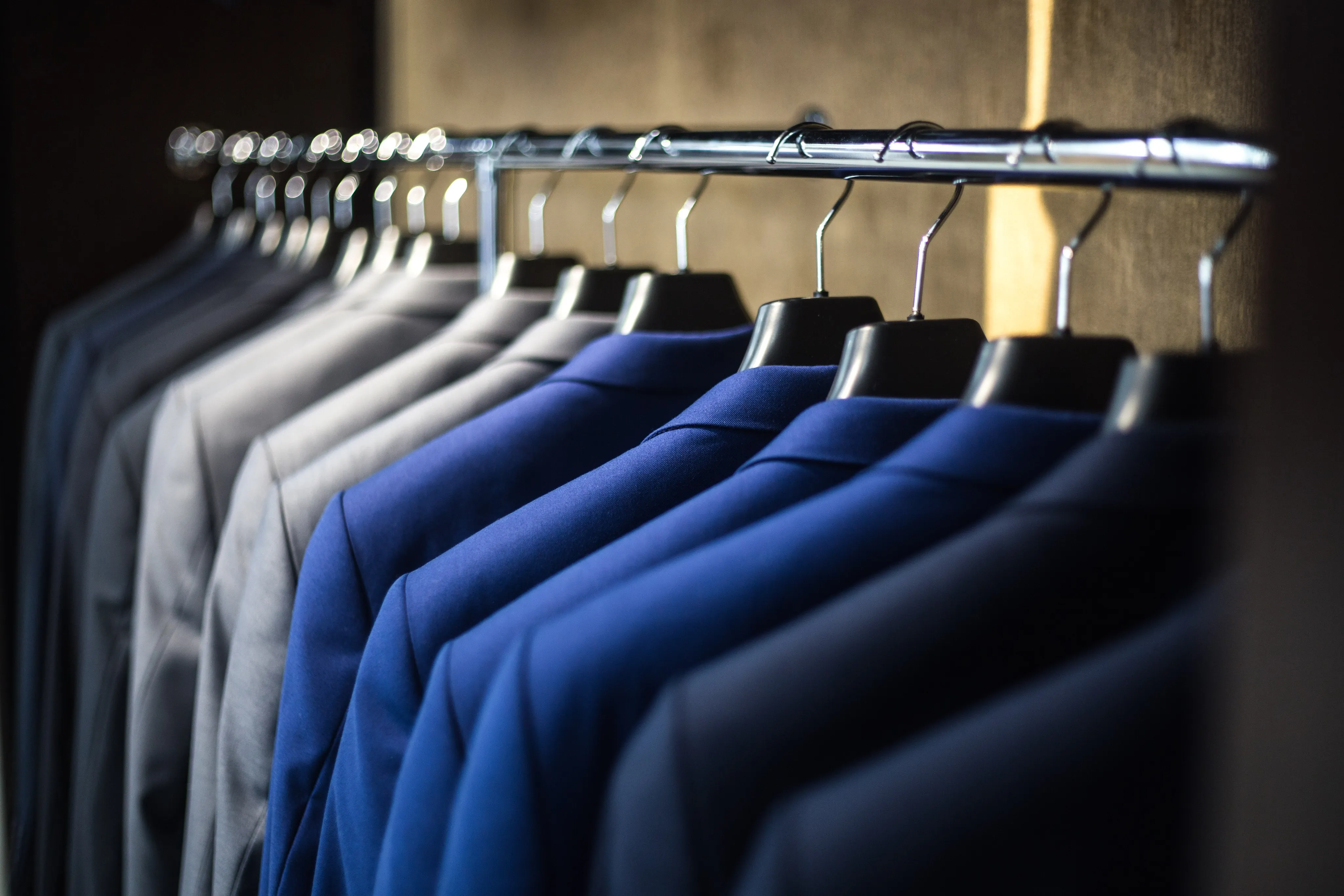 Suits hanging in a row