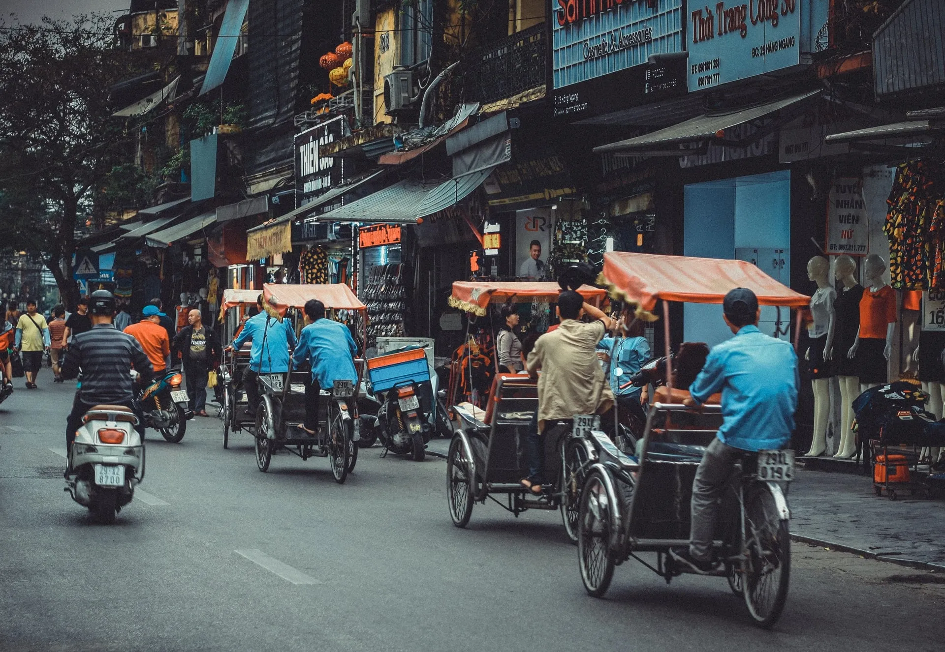 Cyclos on a road in Vietnam