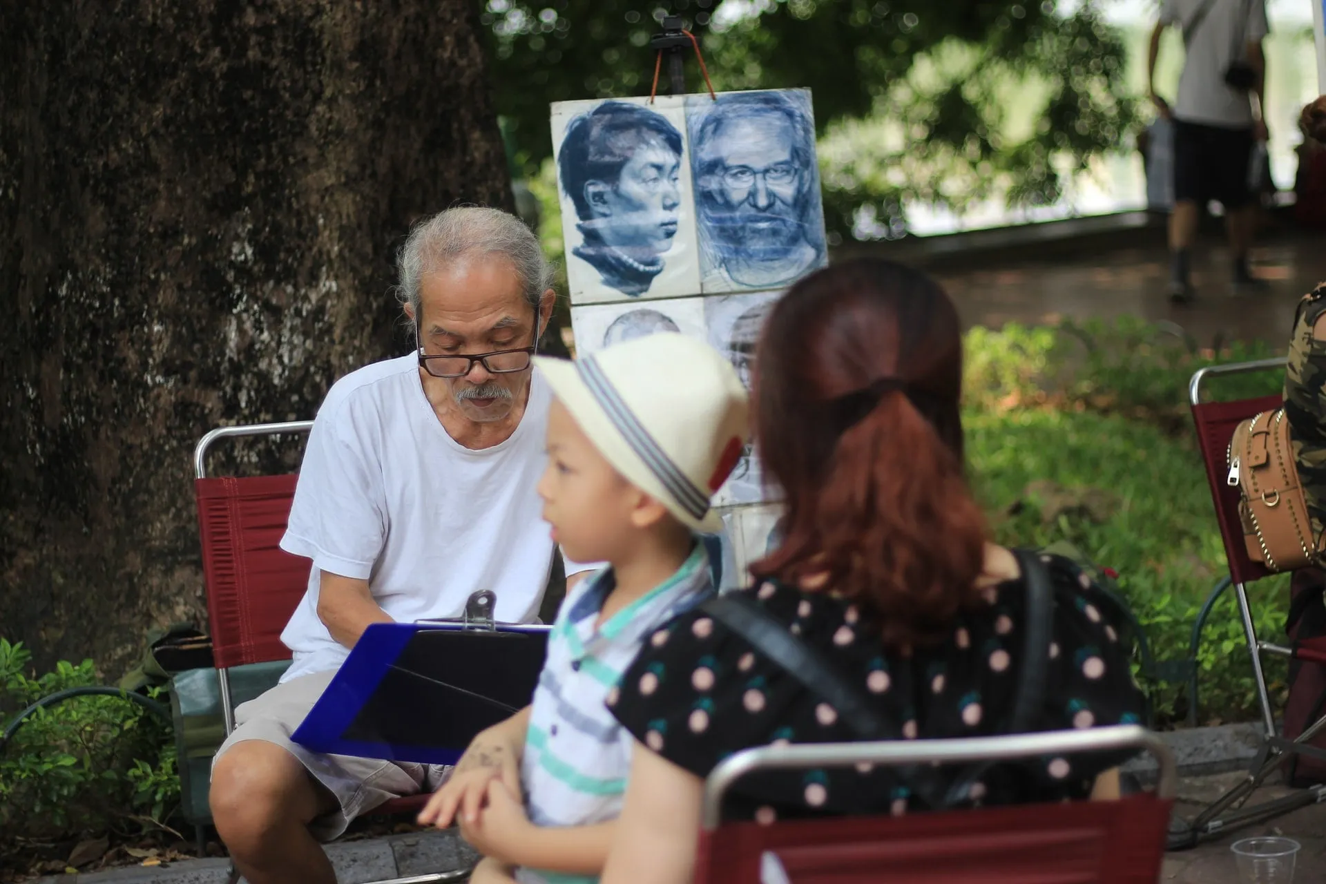 vietnamese man making and selling art