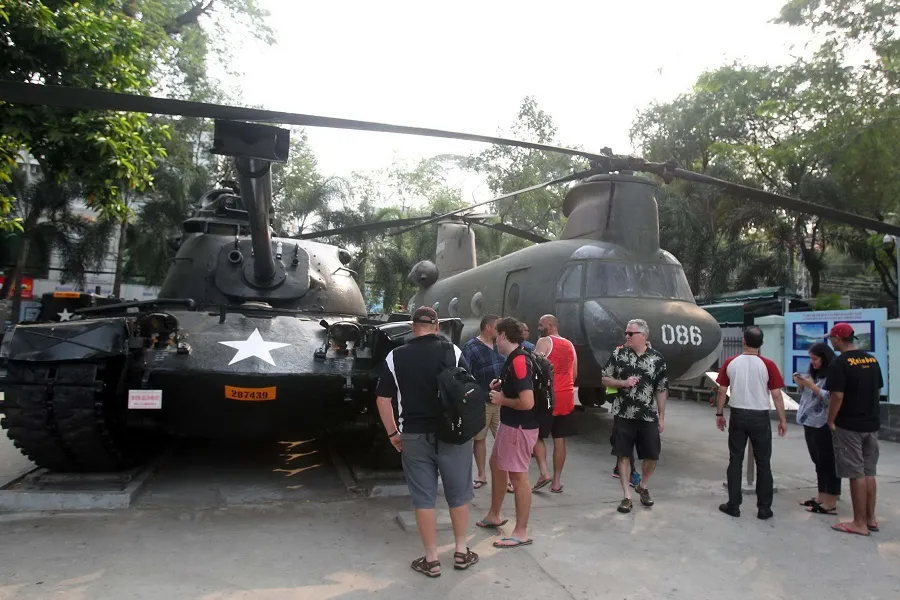 Military tanks are displayed outside