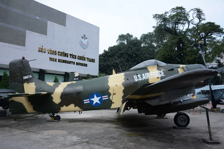 Fighter aircraft are displayed in front of the museum