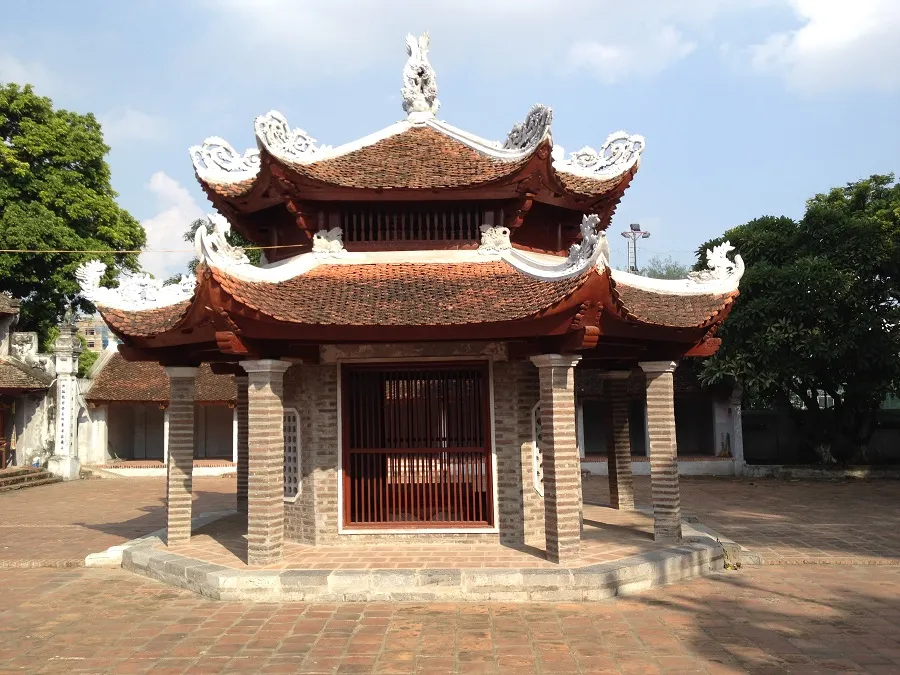 The three-entrance gate is large and imposing