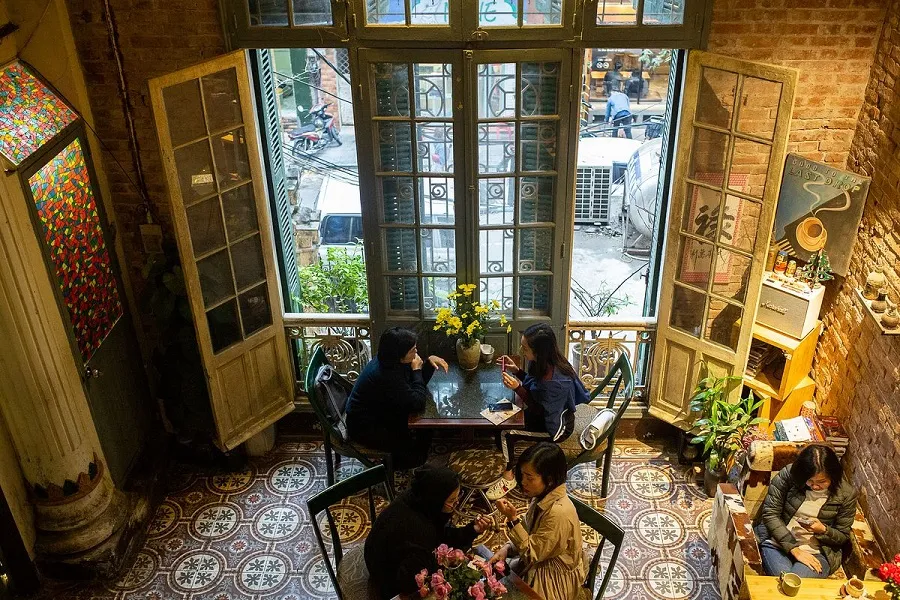 Enjoy a rich cup of egg coffee in a sophisticated space