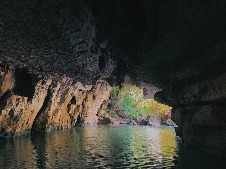 The dark cave entrance brings a mysterious look
